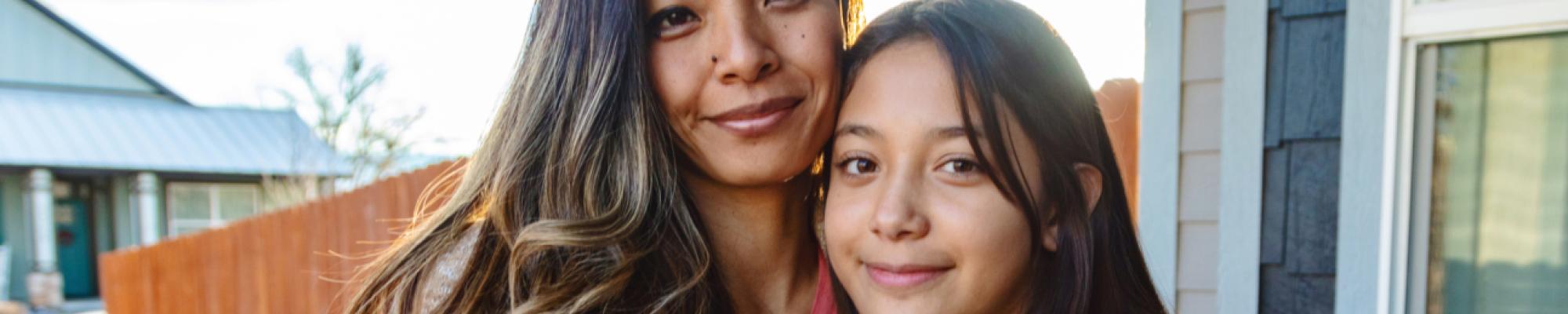 Women and child posing for a photo.